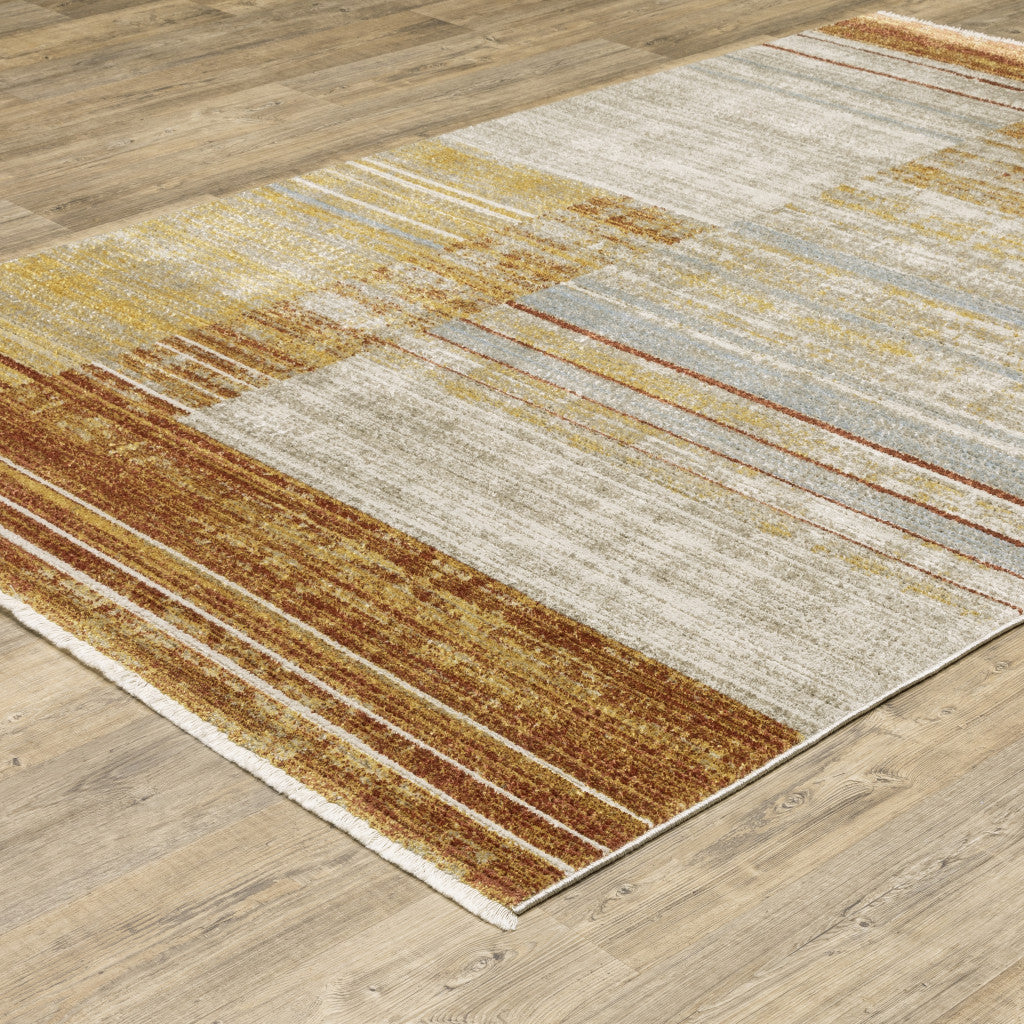 4' X 6' Rust Gold Blue Grey Ivory And Tan Geometric Power Loom Stain Resistant Area Rug With Fringe