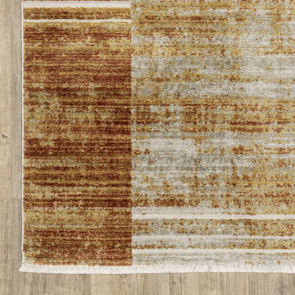 4' X 6' Rust Gold Blue Grey Ivory And Tan Geometric Power Loom Stain Resistant Area Rug With Fringe