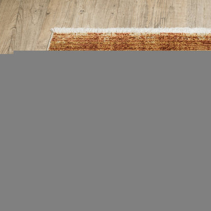 5' X 8' Rust Gold Blue Grey Ivory And Tan Geometric Power Loom Stain Resistant Area Rug With Fringe
