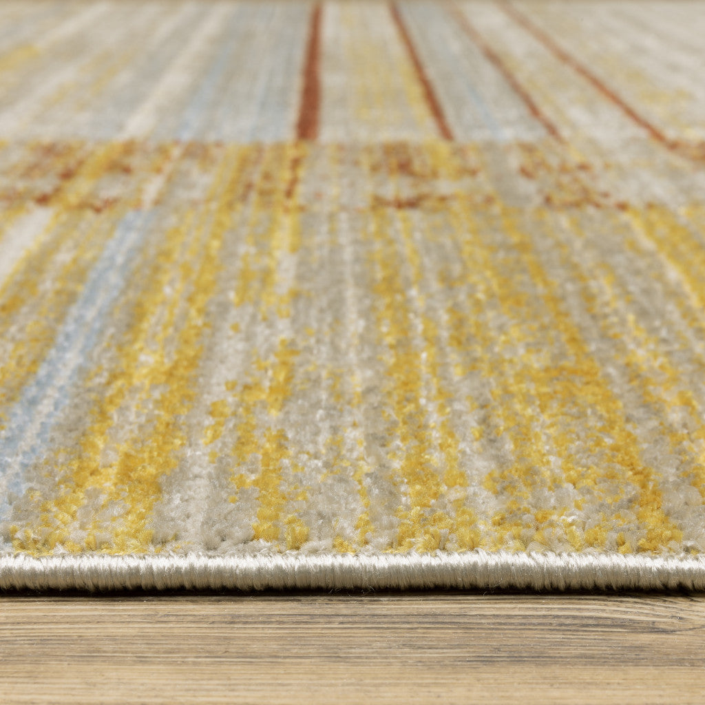 5' X 8' Rust Gold Blue Grey Ivory And Tan Geometric Power Loom Stain Resistant Area Rug With Fringe