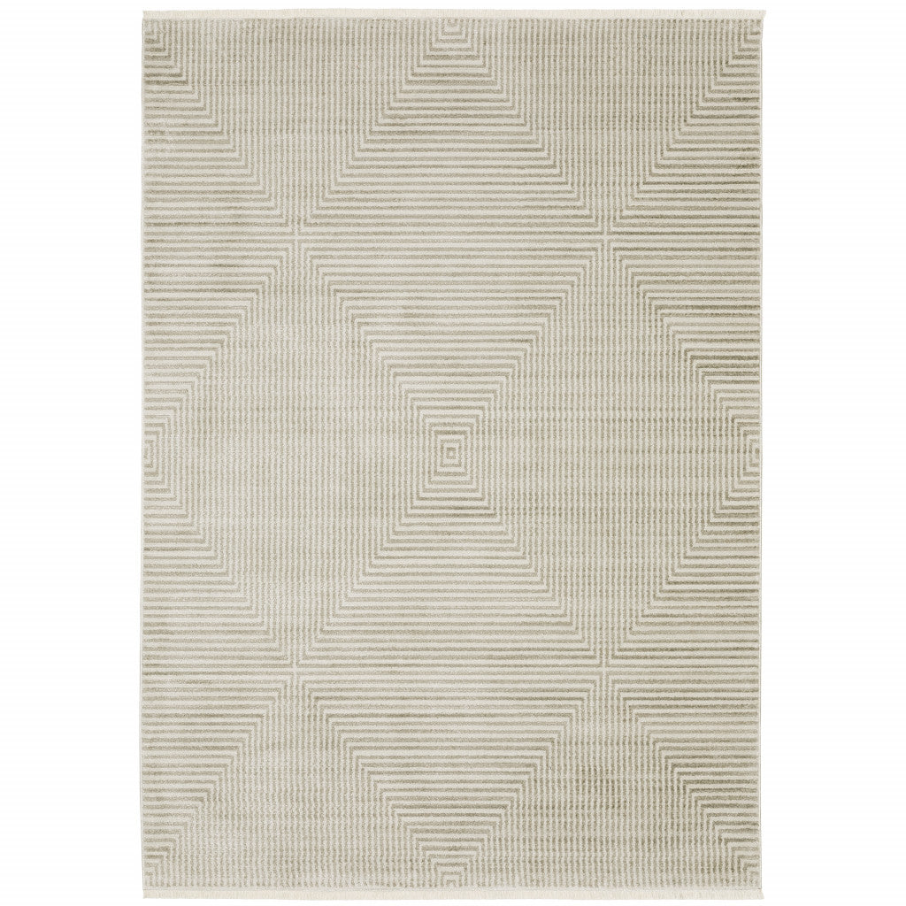 4' X 6' Ivory Beige Taupe And Tan Geometric Power Loom Stain Resistant Area Rug With Fringe