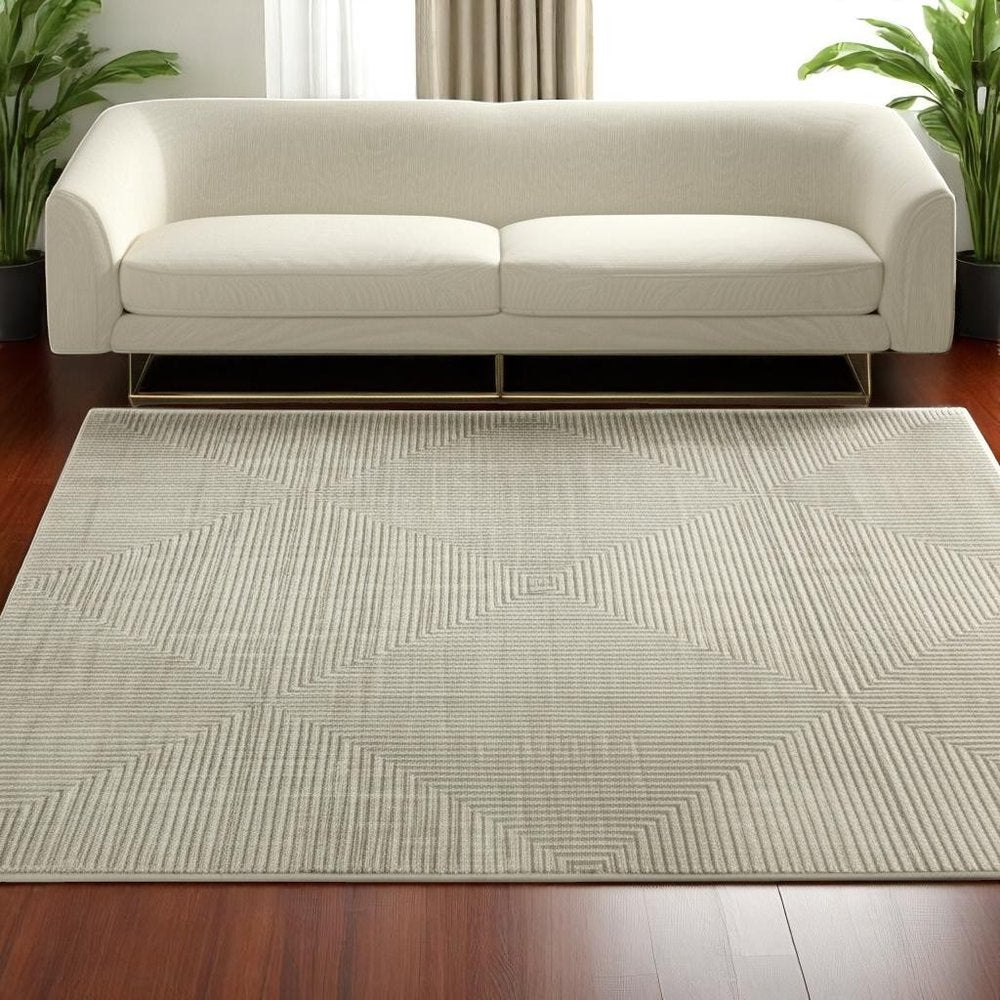 5' x 8' ivory beige taupe & tan geometric power loom stain resistant area rug with fringe