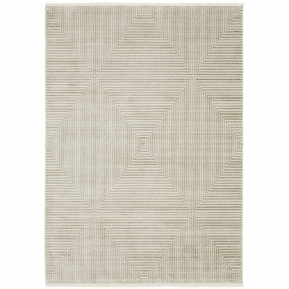 5' X 8' Ivory Beige Taupe And Tan Geometric Power Loom Stain Resistant Area Rug With Fringe