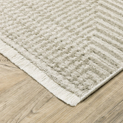 5' x 8' ivory, beige, taupe and tan geometric area rug, power loom, stain resistant, with fringe