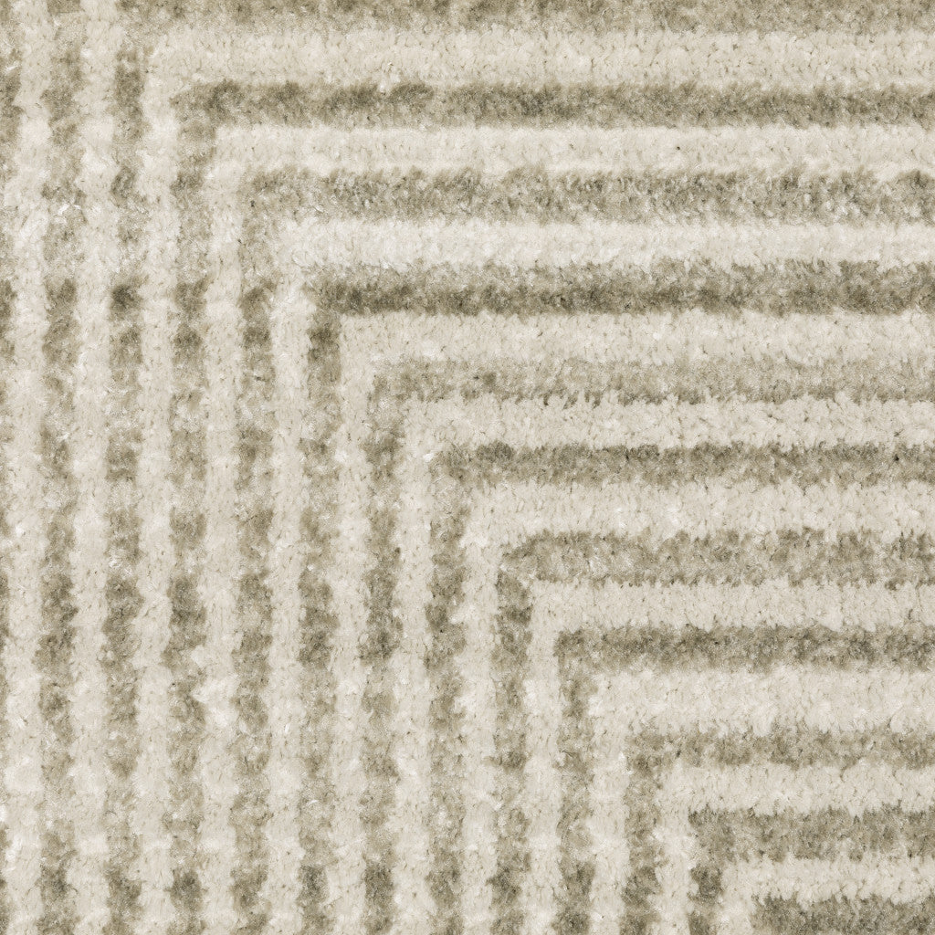 10' X 13' Ivory Beige Taupe And Tan Geometric Power Loom Stain Resistant Area Rug With Fringe