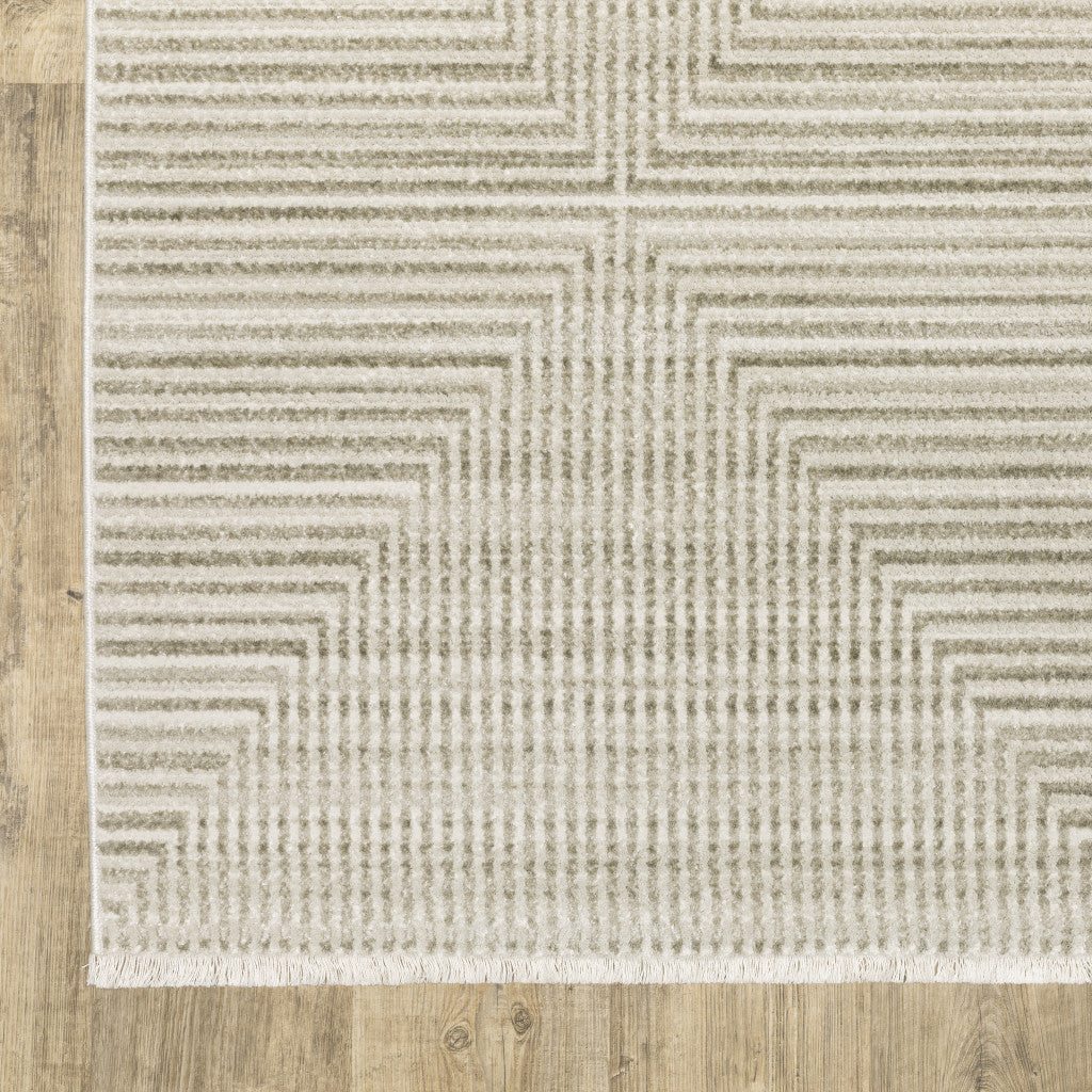 10' X 13' Ivory Beige Taupe And Tan Geometric Power Loom Stain Resistant Area Rug With Fringe