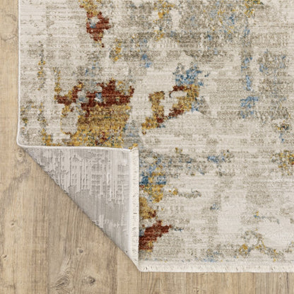 4' X 6' Beige Grey Gold Blue Rust And Teal Abstract Power Loom Stain Resistant Area Rug With Fringe