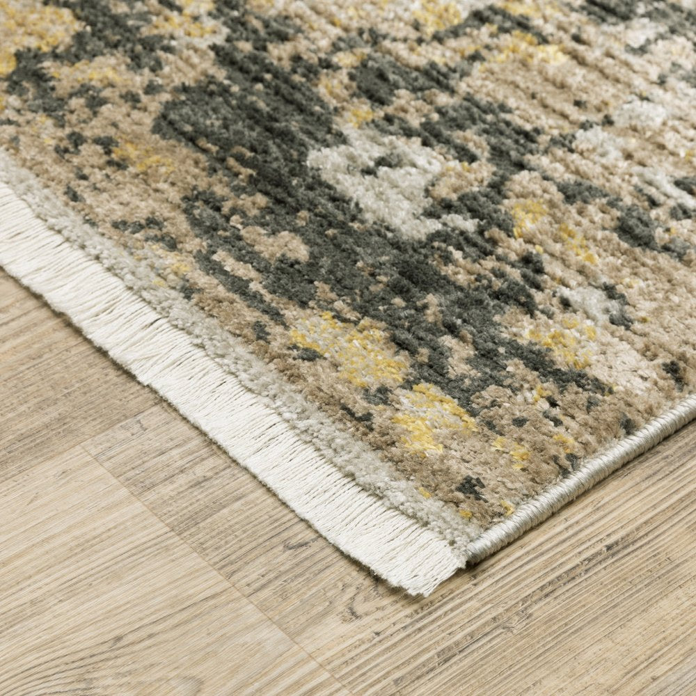5' X 8' Grey Gold Black Charcoal And Beige Abstract Power Loom Stain Resistant Area Rug With Fringe