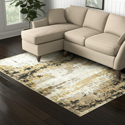5' X 8' Grey Gold Black Charcoal And Beige Abstract Power Loom Stain Resistant Area Rug With Fringe