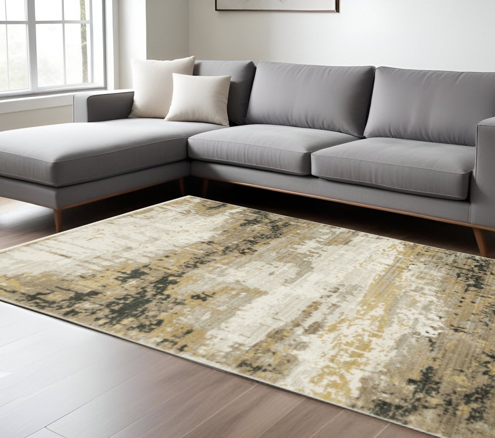 10' X 13' Grey Gold Black Charcoal And Beige Abstract Power Loom Stain Resistant Area Rug With Fringe