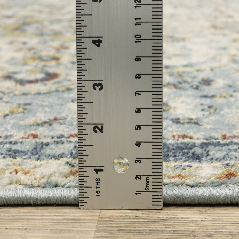 2' x 8' oriental runner rug in blue, beige, rust, gold and teal; power loom, stain resistant.