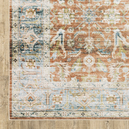5' X 7' Rust Blue Ivory And Gold Oriental Printed Stain Resistant Non Skid Area Rug