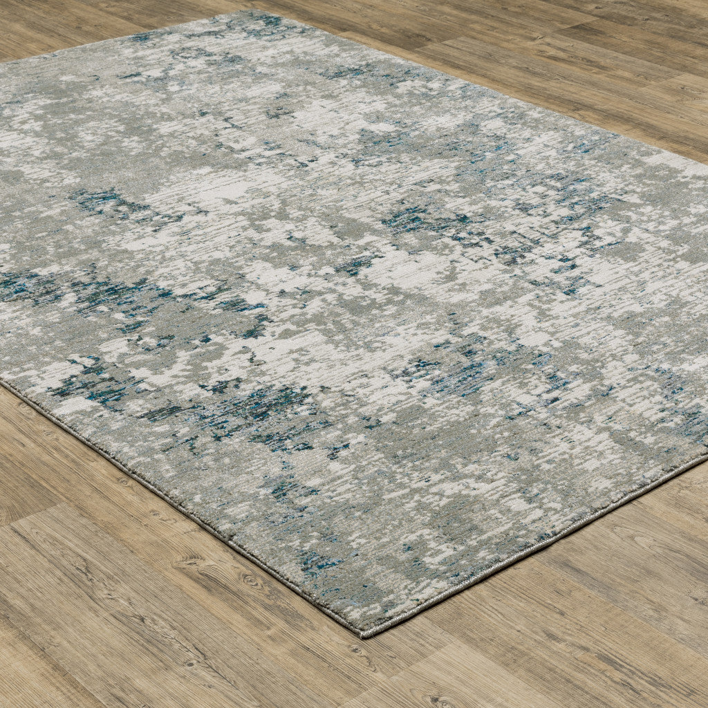 7' X 10' Blue and Beige Abstract Power Loom Area Rug