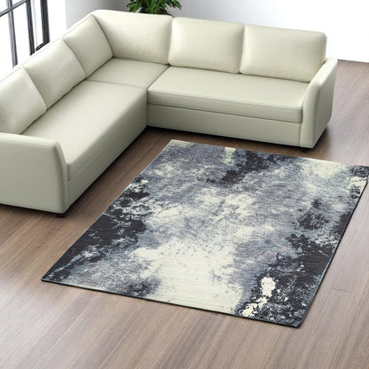 7' X 10' Blue and Ivory Abstract Power Loom Area Rug