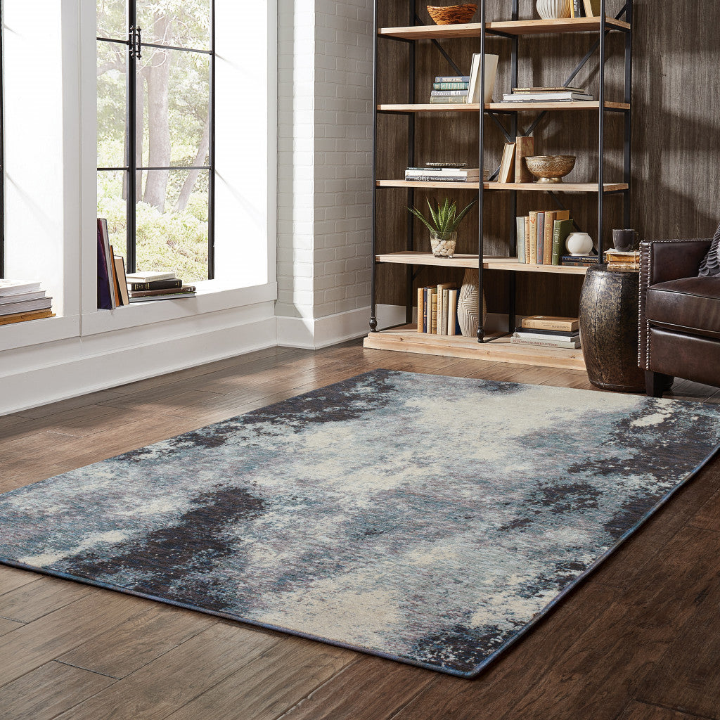8' x 11' Blue and Ivory Abstract Power Loom Area Rug