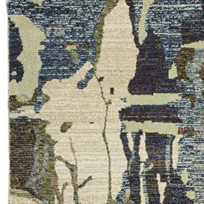 Abstract woven runner rug in blue and gray with textured irregular shapes.