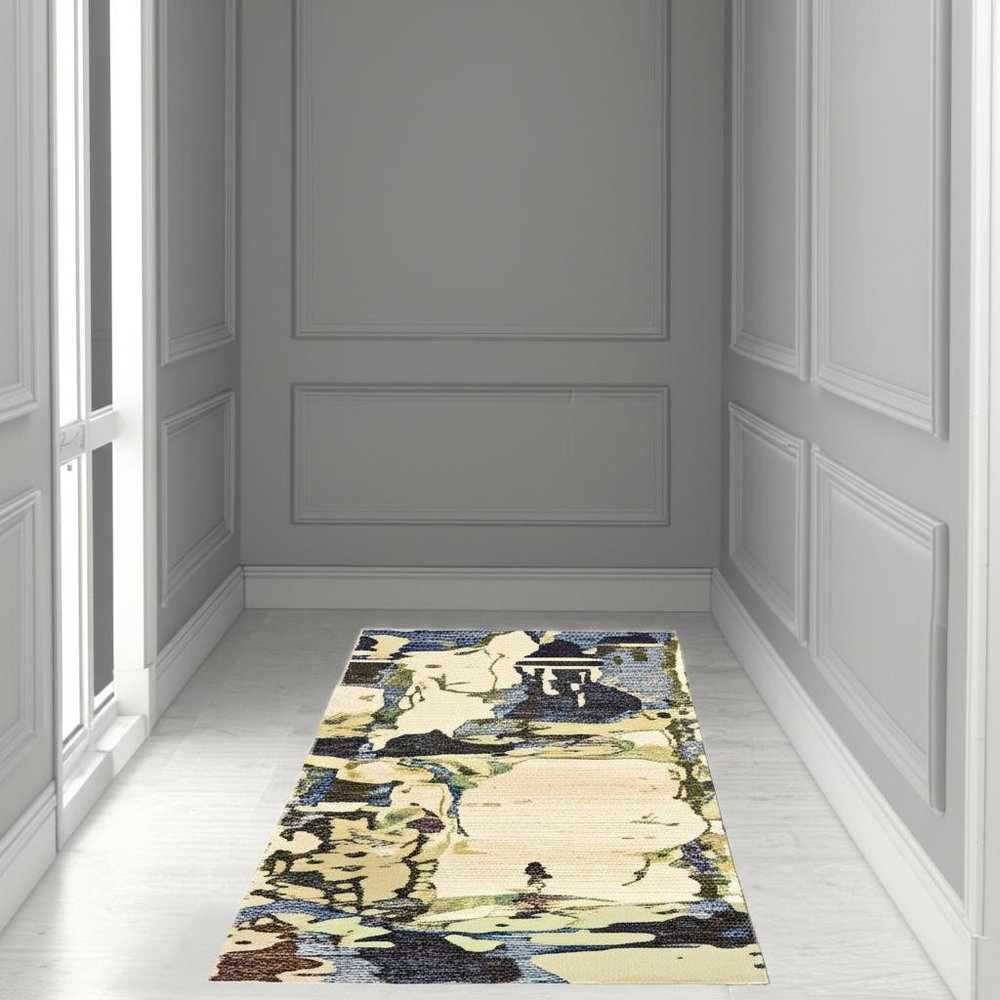 Gray-paneled hallway with a long blue & gray abstract runner rug along light flooring.