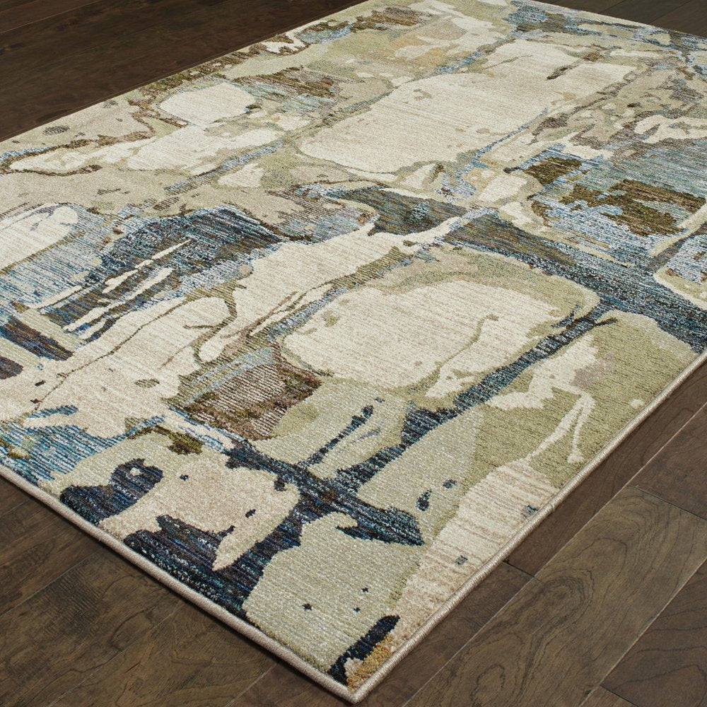 8' x 11' blue and gray abstract power loom area rug.