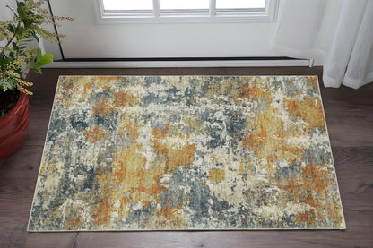 2' X 3' Teal Blue Orange Gold Grey Tan Brown And Beige Abstract Printed Stain Resistant Non Skid Area Rug
