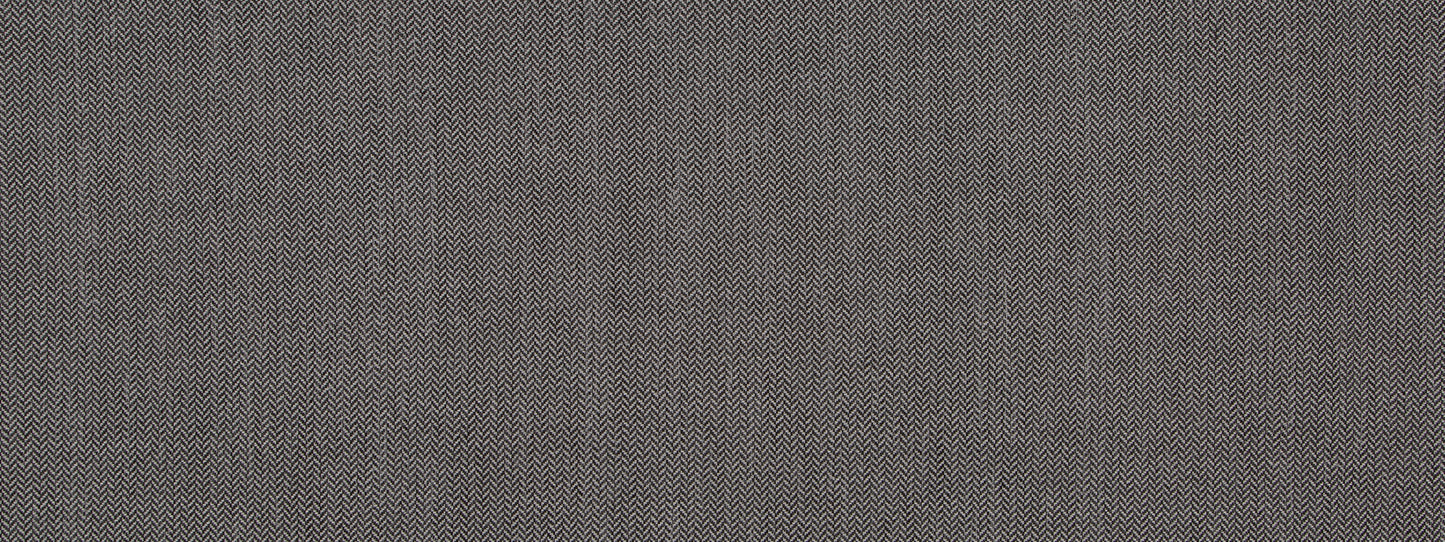 Close-up of slate gray tweed fabric texture with tiny woven flecks; upholstery fabric.
