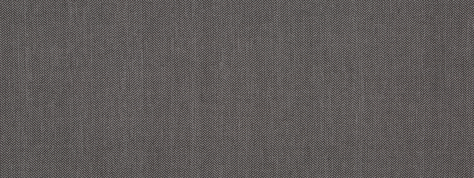 Close-up of slate gray tweed fabric texture with tiny woven flecks; upholstery fabric.