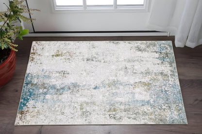 2' X 3' Ivory And Blue Abstract Printed Stain Resistant Non Skid Area Rug