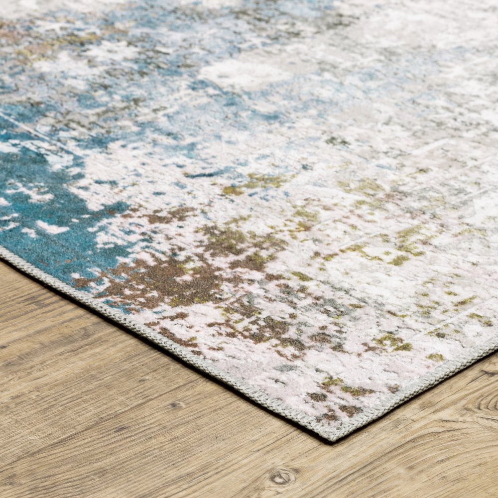 2' X 3' Ivory And Blue Abstract Printed Stain Resistant Non Skid Area Rug
