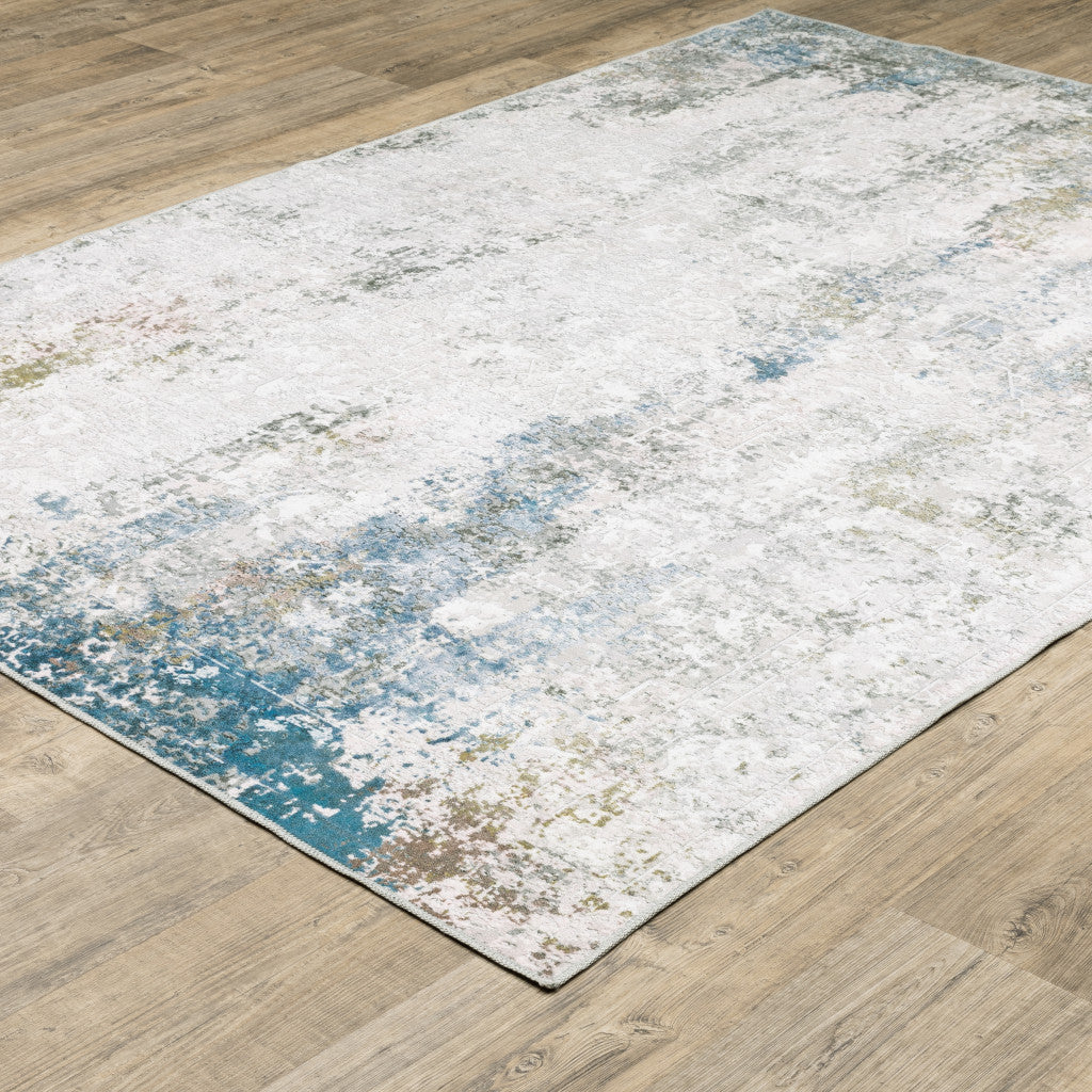 2' X 3' Ivory And Blue Abstract Printed Stain Resistant Non Skid Area Rug