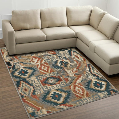 10' X 13' Blue Teal Grey Orange Gold Ivory And Rust Geometric Power Loom Stain Resistant Area Rug