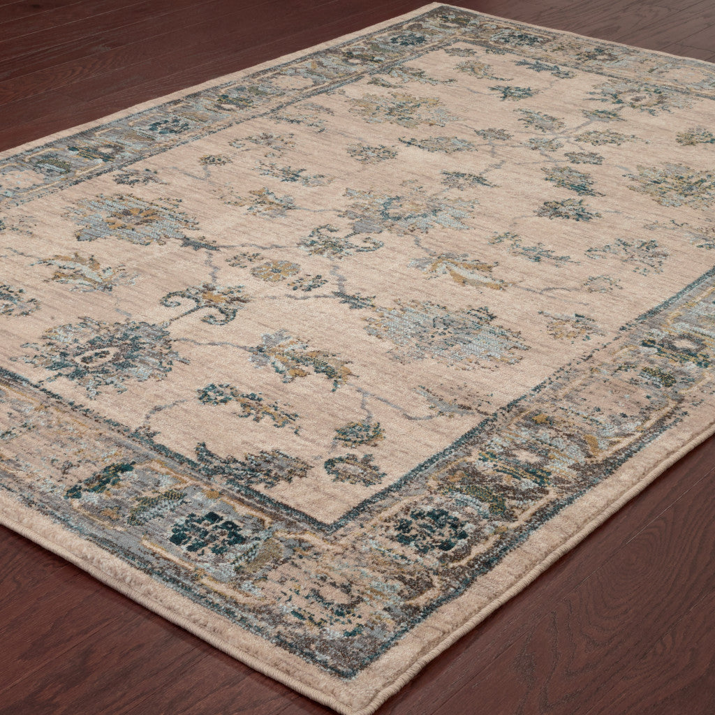 6' X 9' Ivory Blue Gold And Grey Oriental Power Loom Stain Resistant Area Rug