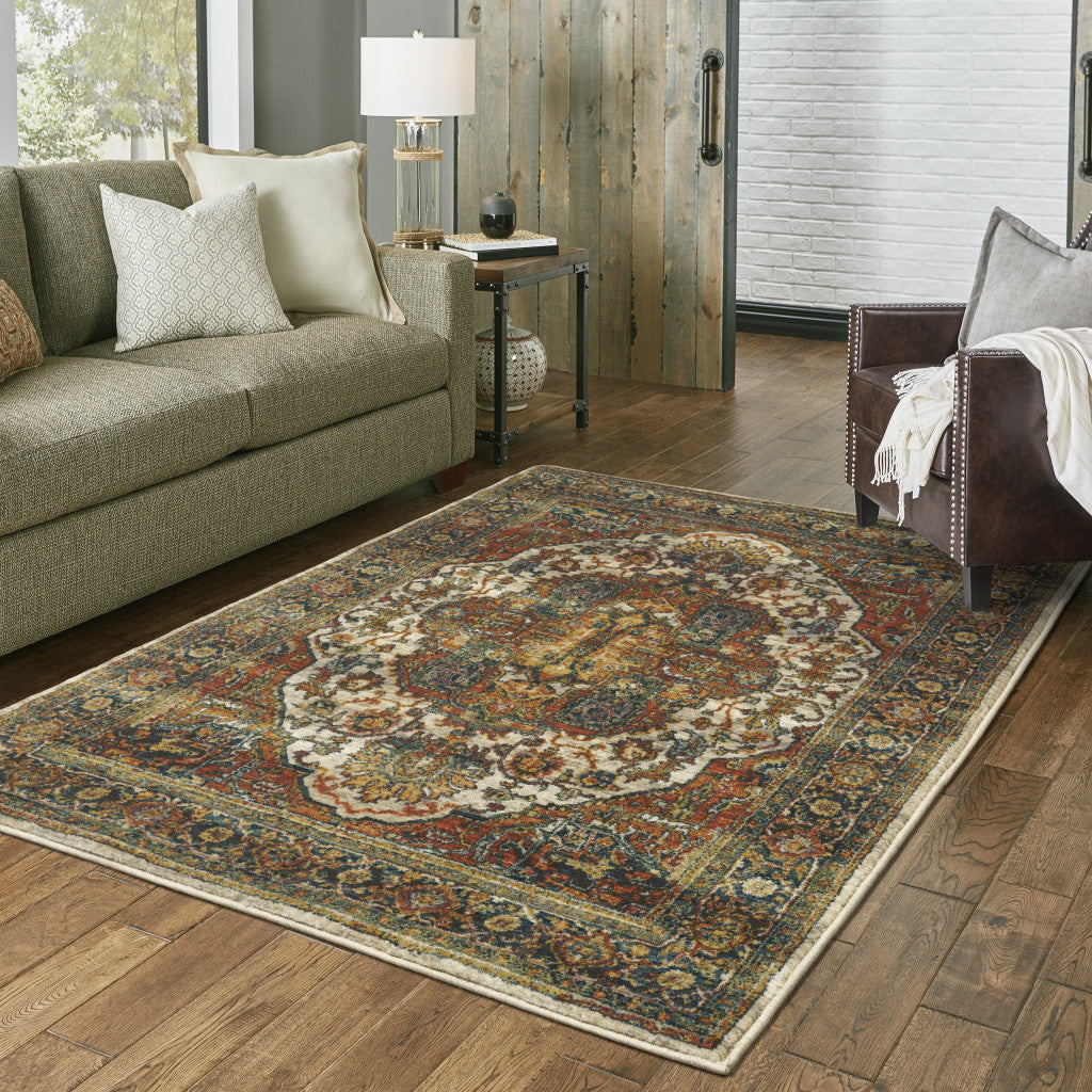 6' X 9' Red Gold Orange Green Ivory Rust And Blue Oriental Power Loom Stain Resistant Area Rug