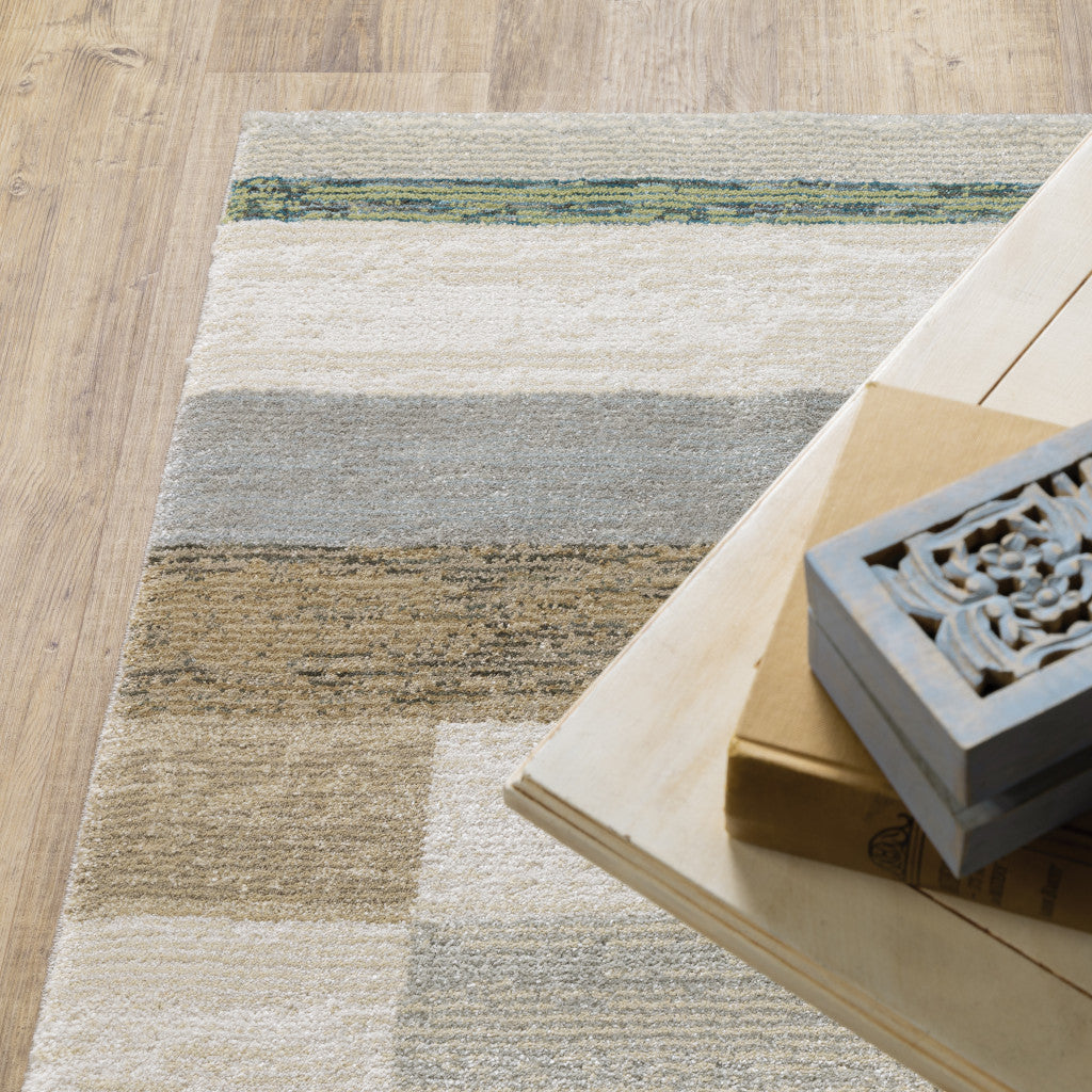 3' X 5' Beige Gold Black Grey Tan Teal and Rust Geometric Power Loom Area Rug