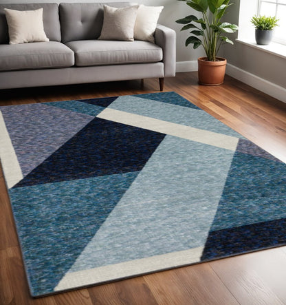 7' X 10' Blue Purple Grey and Teal Geometric Power Loom Area Rug
