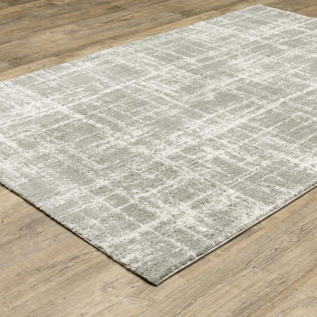 8' X 11' Grey And Ivory Abstract Shag Power Loom Stain Resistant Area Rug