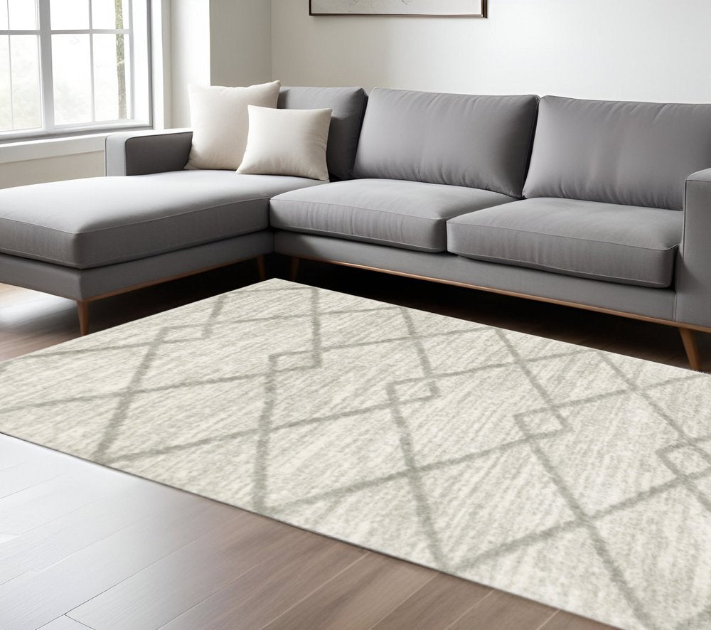 10' x 13' ivory and grey geometric shag area rug, power loom, stain resistant.