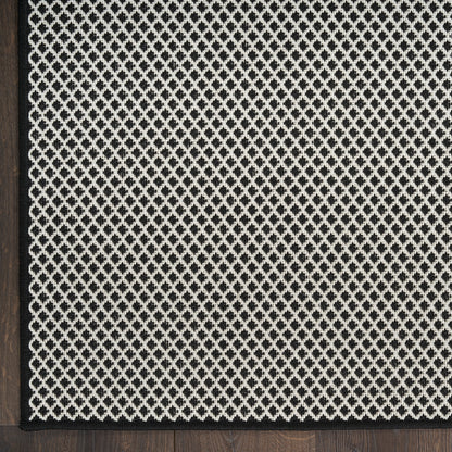 Black-framed decorative lattice panel featuring a white diamond mesh pattern on a dark textured background.