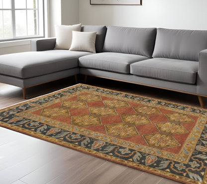 5' X 8' Tan Orange And Brown Wool Floral Hand Knotted Stain Resistant Area Rug