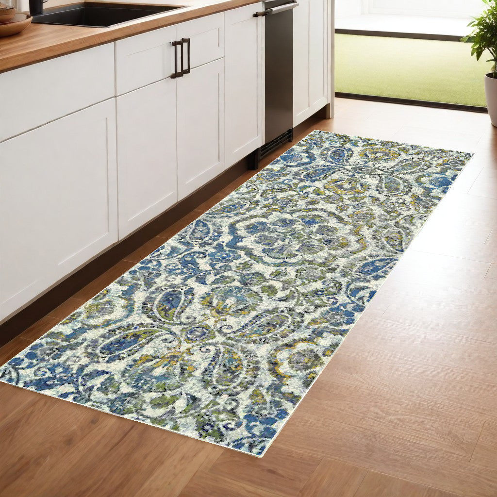 7' X 10' Ivory Blue And Green Floral Stain Resistant Area Rug