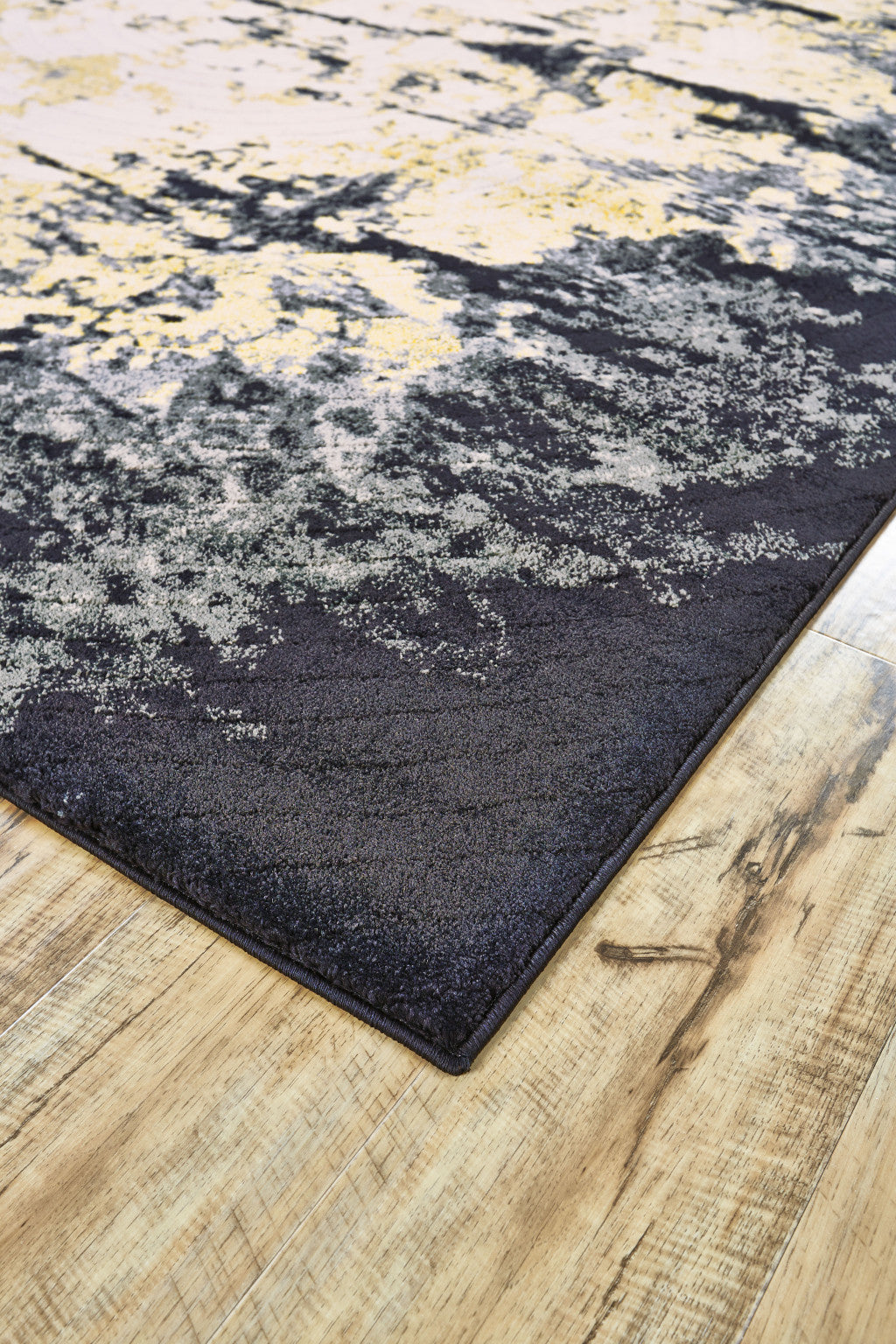 5' X 8' Black Gray And Gold Geometric Stain Resistant Area Rug