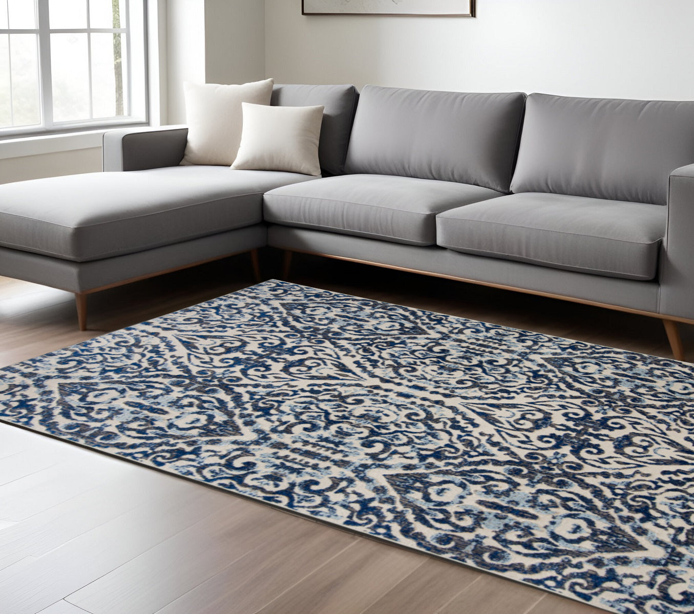 10' X 14' Blue Ivory And Black Floral Distressed Stain Resistant Area Rug