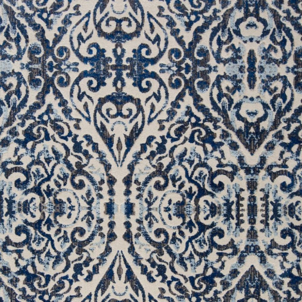 10' X 14' Blue Ivory And Black Floral Distressed Stain Resistant Area Rug