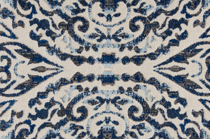 10' X 14' Blue Ivory And Black Floral Distressed Stain Resistant Area Rug