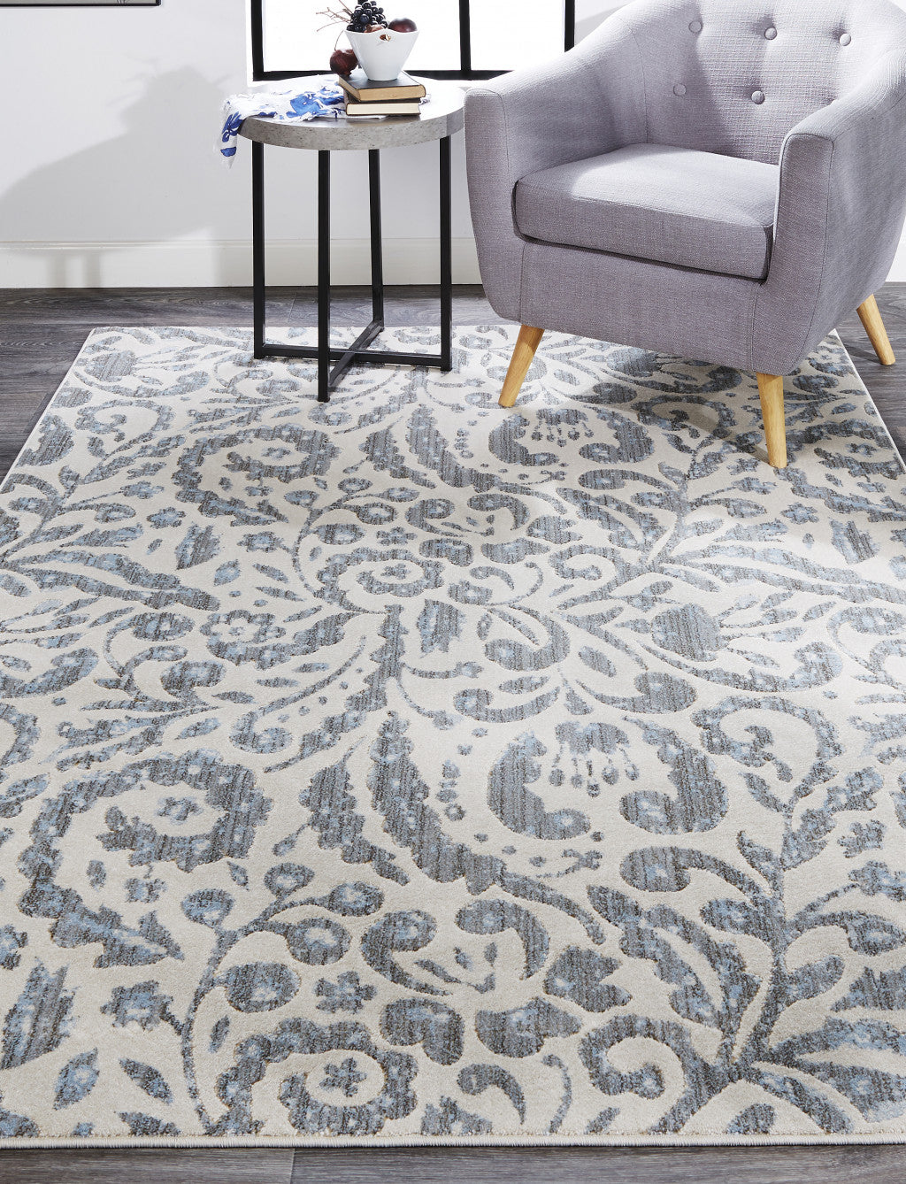 10' X 14' Blue Ivory And Tan Floral Distressed Stain Resistant Area Rug