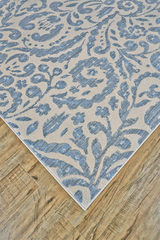 5' X 8' Blue Ivory And Tan Floral Distressed Stain Resistant Area Rug