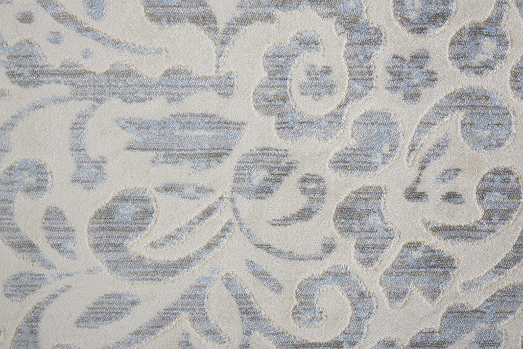 10' X 14' Blue Ivory And Tan Floral Distressed Stain Resistant Area Rug