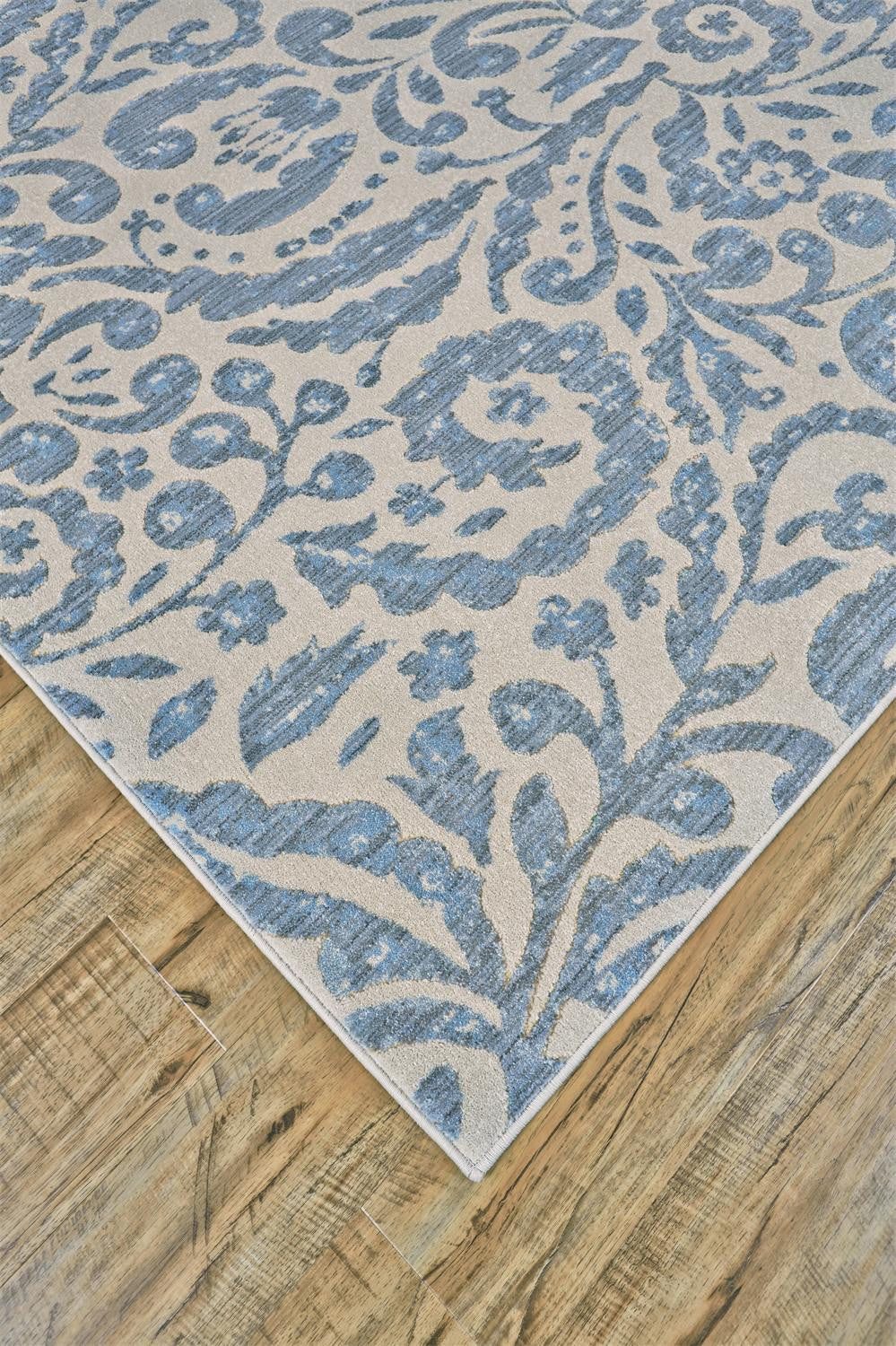 2' X 4' Blue Ivory And Tan Floral Distressed Stain Resistant Area Rug