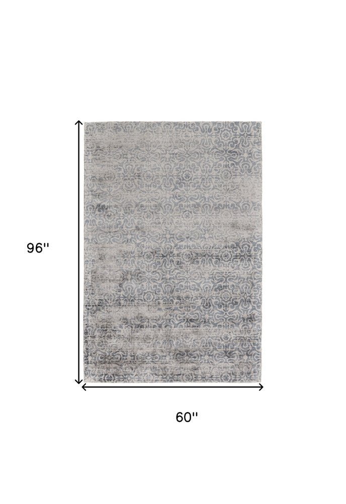5' X 8' Gray and Ivory Abstract Hand Woven Area Rug