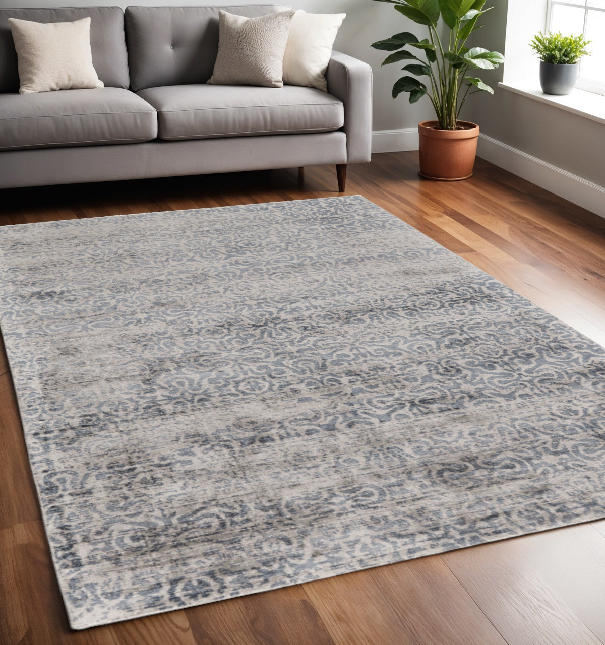 5' X 8' Gray and Ivory Abstract Hand Woven Area Rug