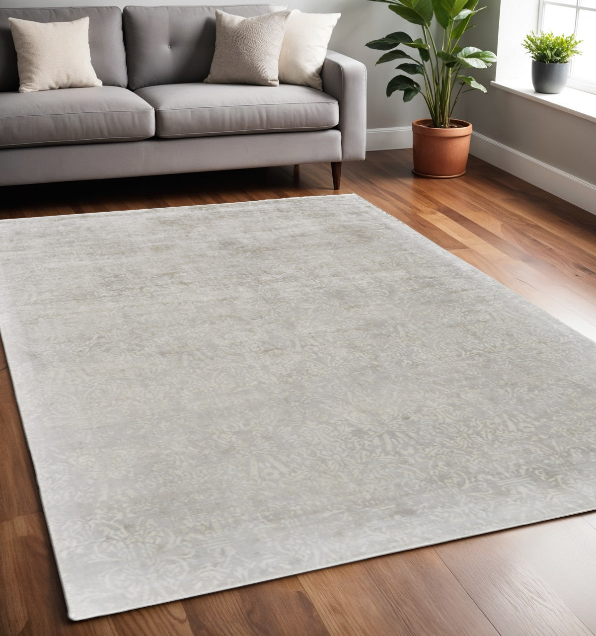 5' X 8' Gray and Ivory Abstract Hand Woven Area Rug