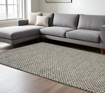 5' X 8' Gray and Ivory Wool Floral Hand Woven Area Rug